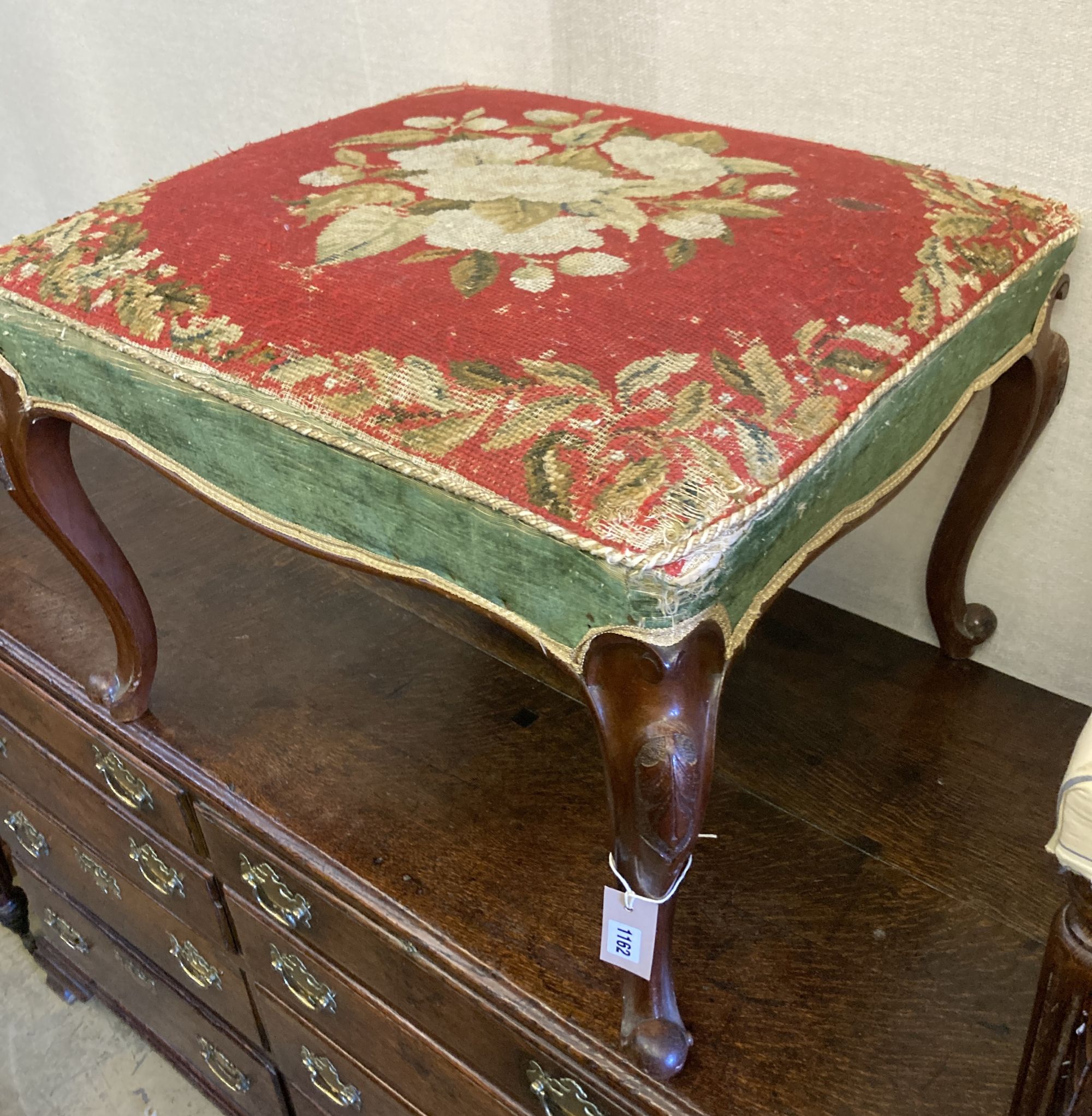 A Victorian walnut dressing stool with tapestry seat, width 66cm, depth 60cm, height 48cm